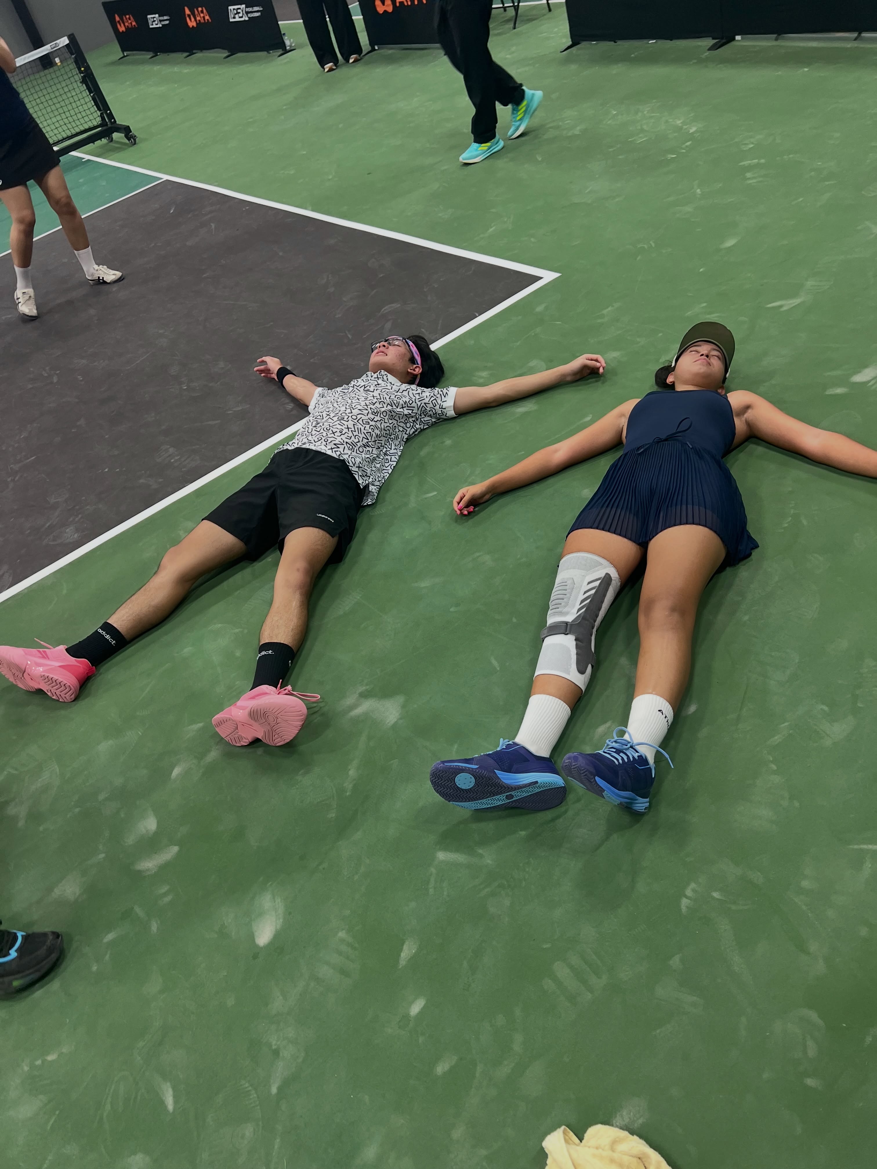 Rex Thais and Aline Morales celebrate their Open Doubles title in Cambodia