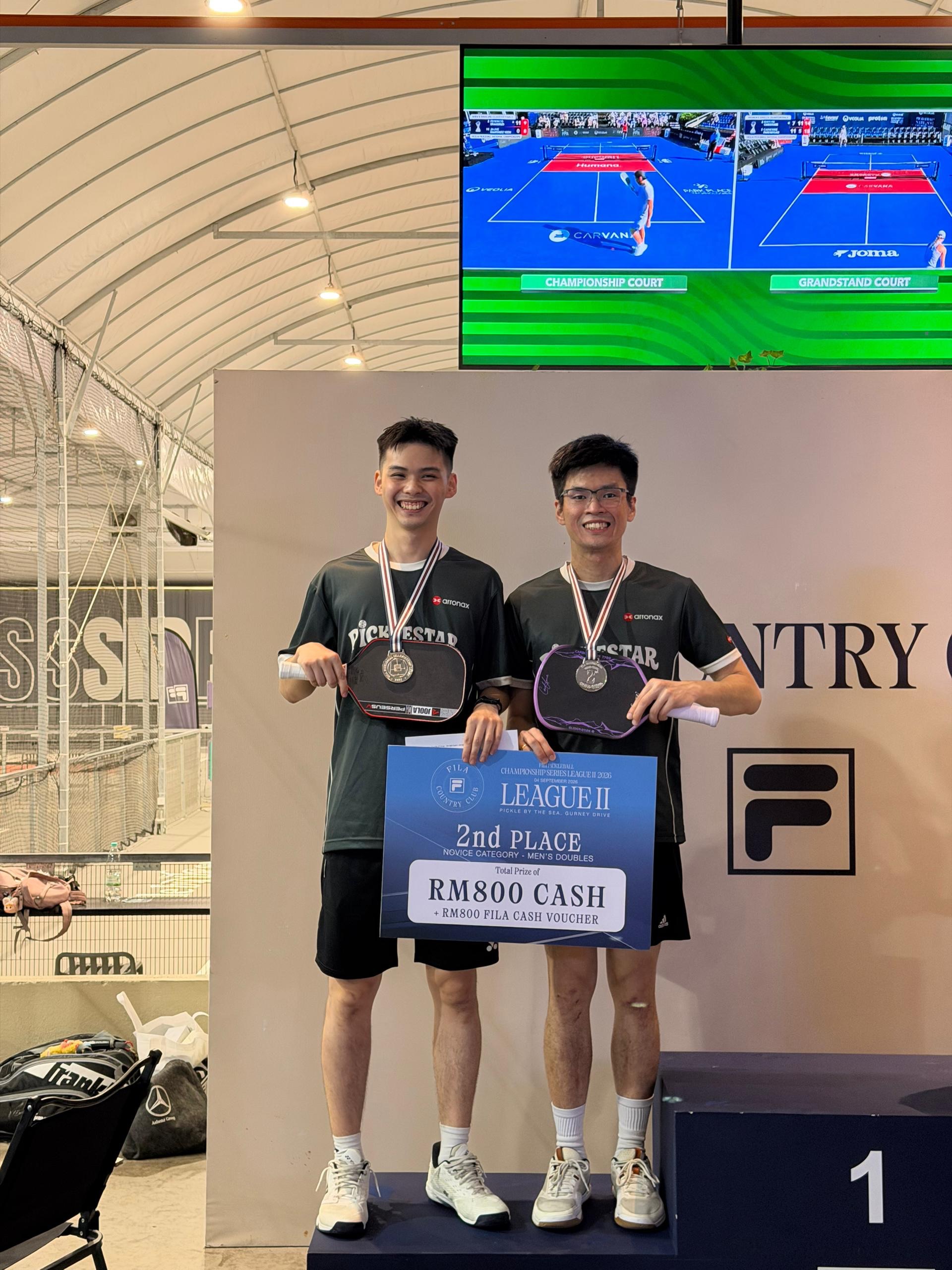 Picklestar Penang's Novice Men's Doubles runners-up with their 2nd place prize signage