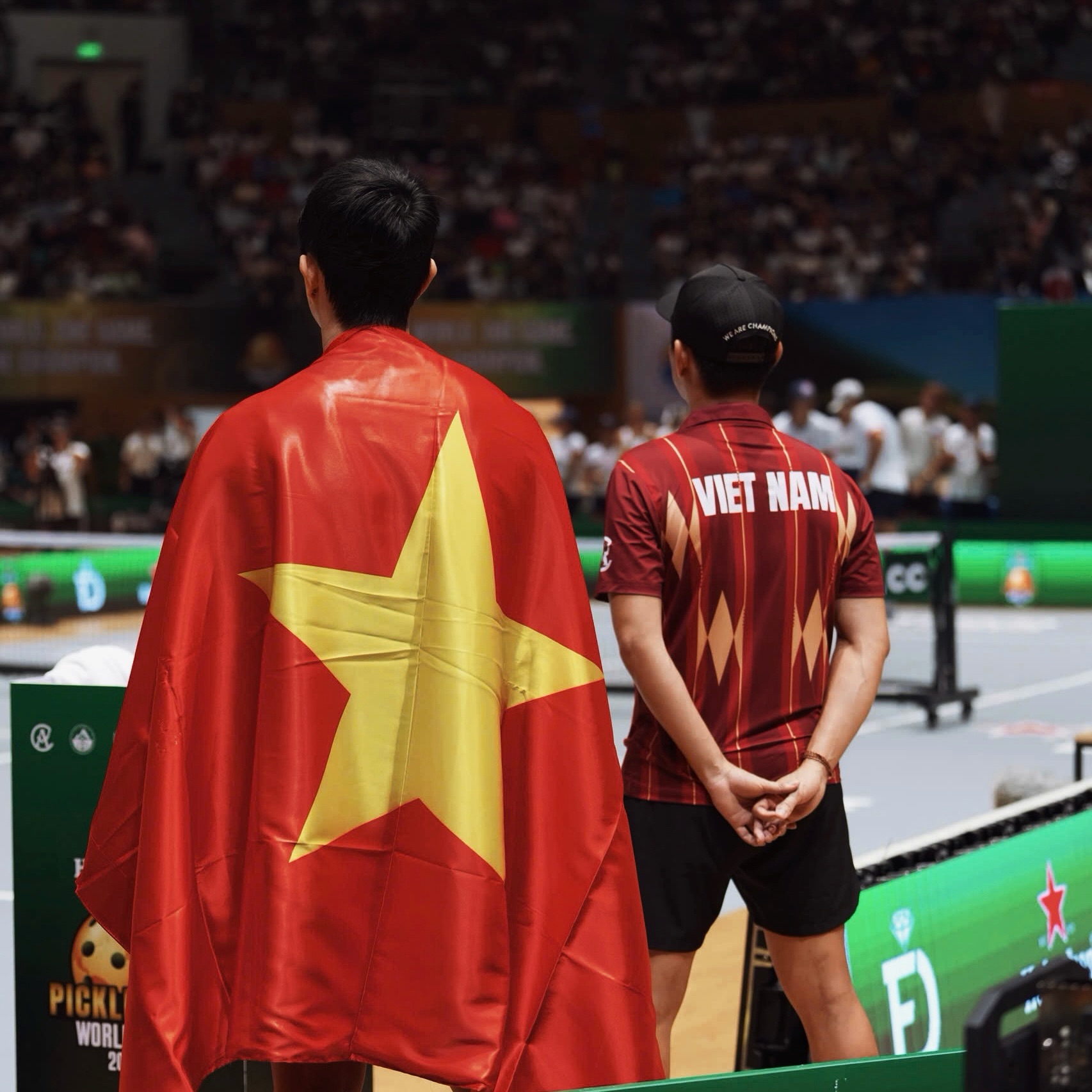 Team Vietnam Pro players celebrate with fans after reaching the World Cup final.