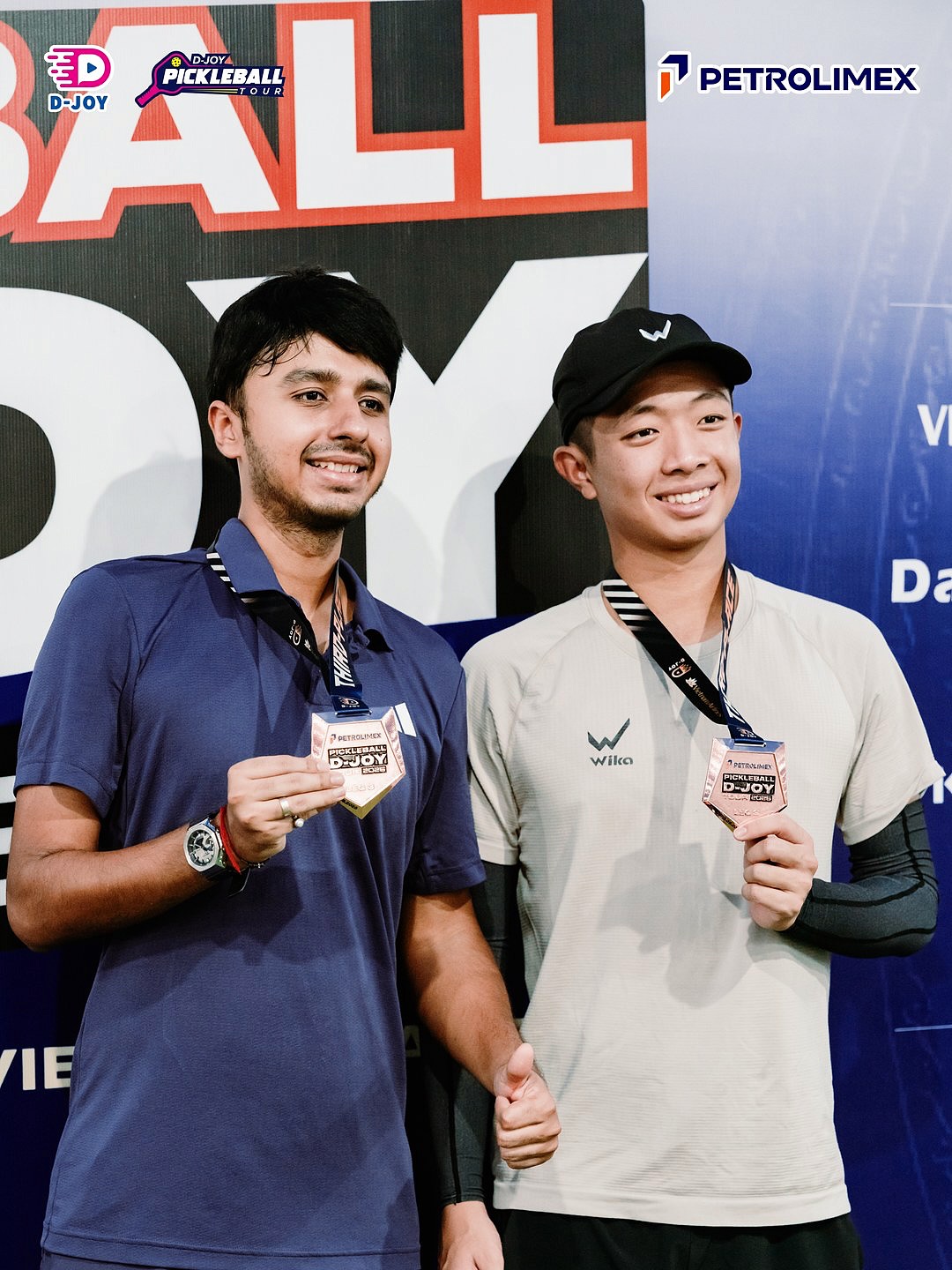 Harsh Mehta and Quang Duong holding their bronze medals at D-Joy Tour Leg 3