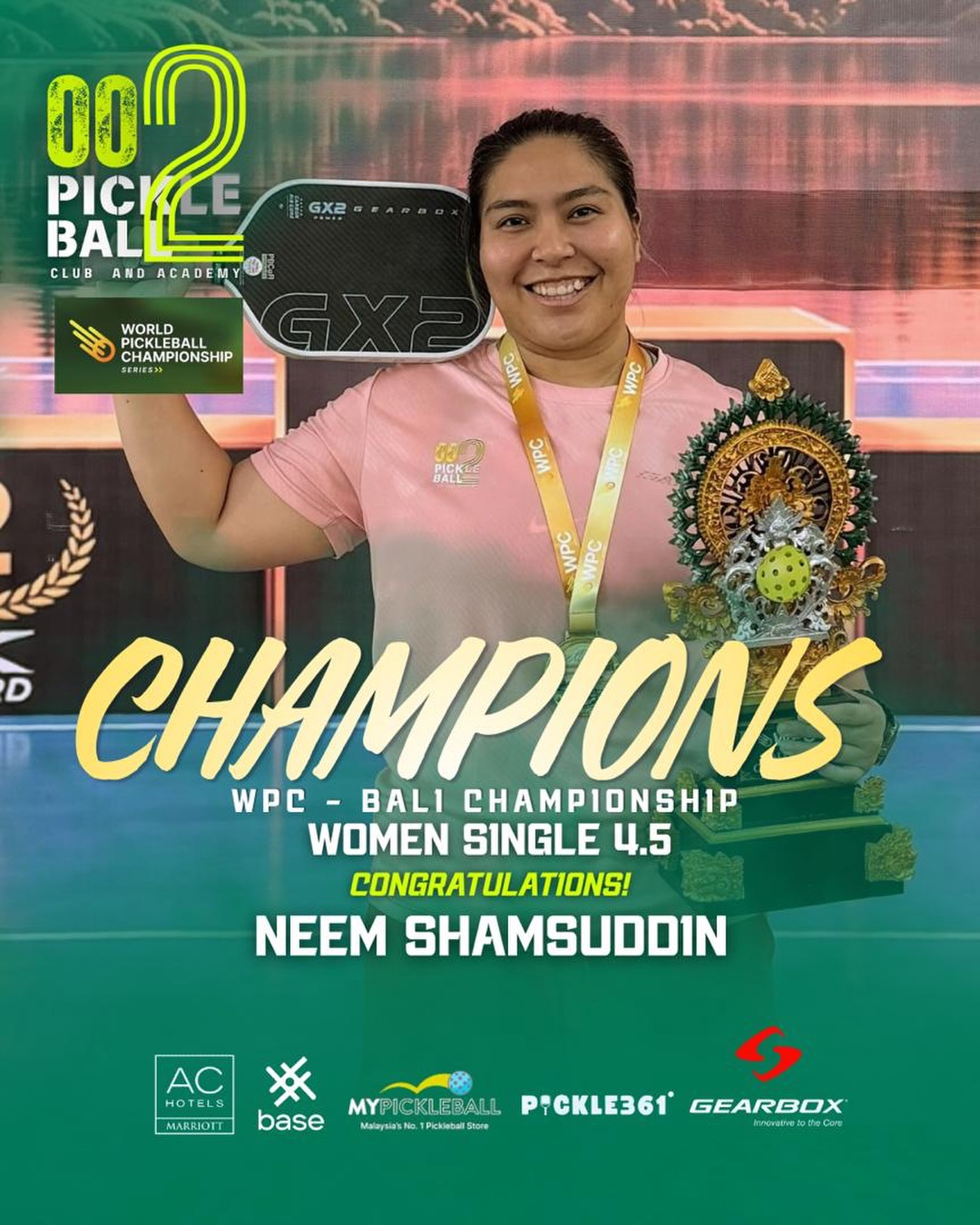 Neem Shamsuddin holding the WPC Bali trophy and her medal