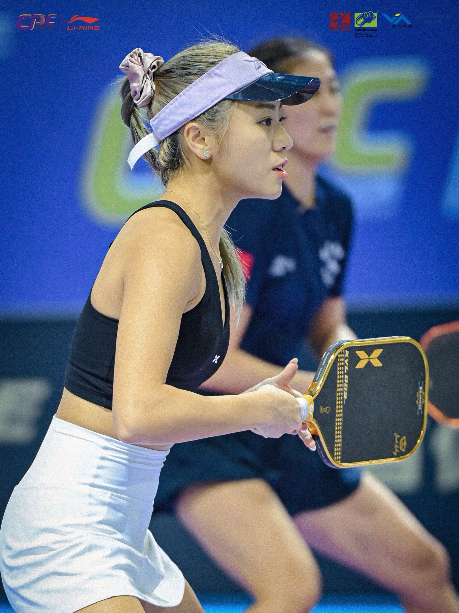 Agnes Fan in her ready stance during a women's doubles match at the Guiyang stop of the Li-Ning Cup China Pickleball Tour