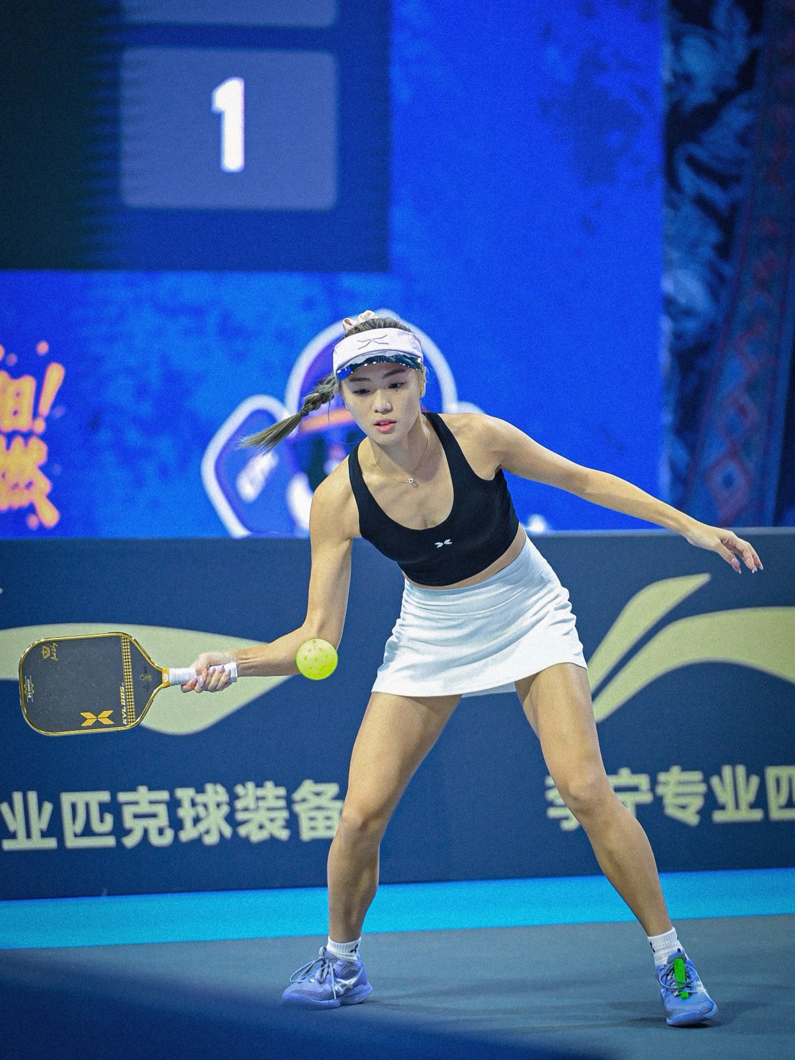 Agnes Fan stepping into a forehand during a Guiyang match with the ball at her paddle