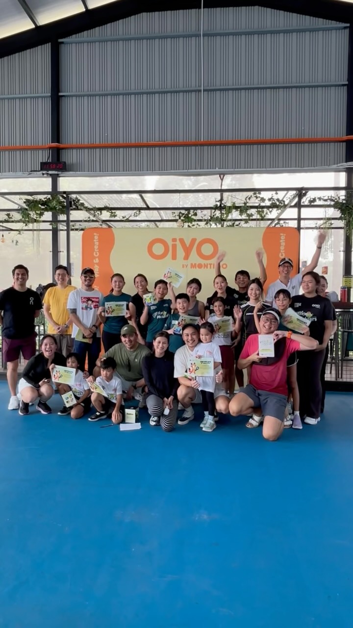 Little Picklers graduates and coaches holding certificates in front of an OiYO by Montigo banner