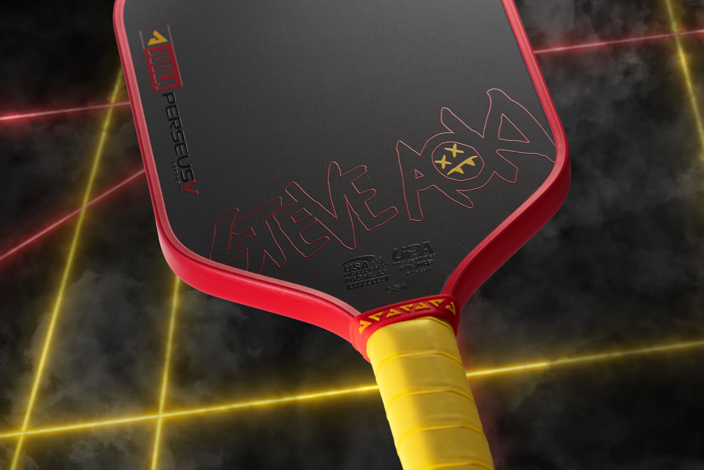 Hiro Red limited edition JOOLA x Steve Aoki Perseus Pro V paddle with a yellow grip