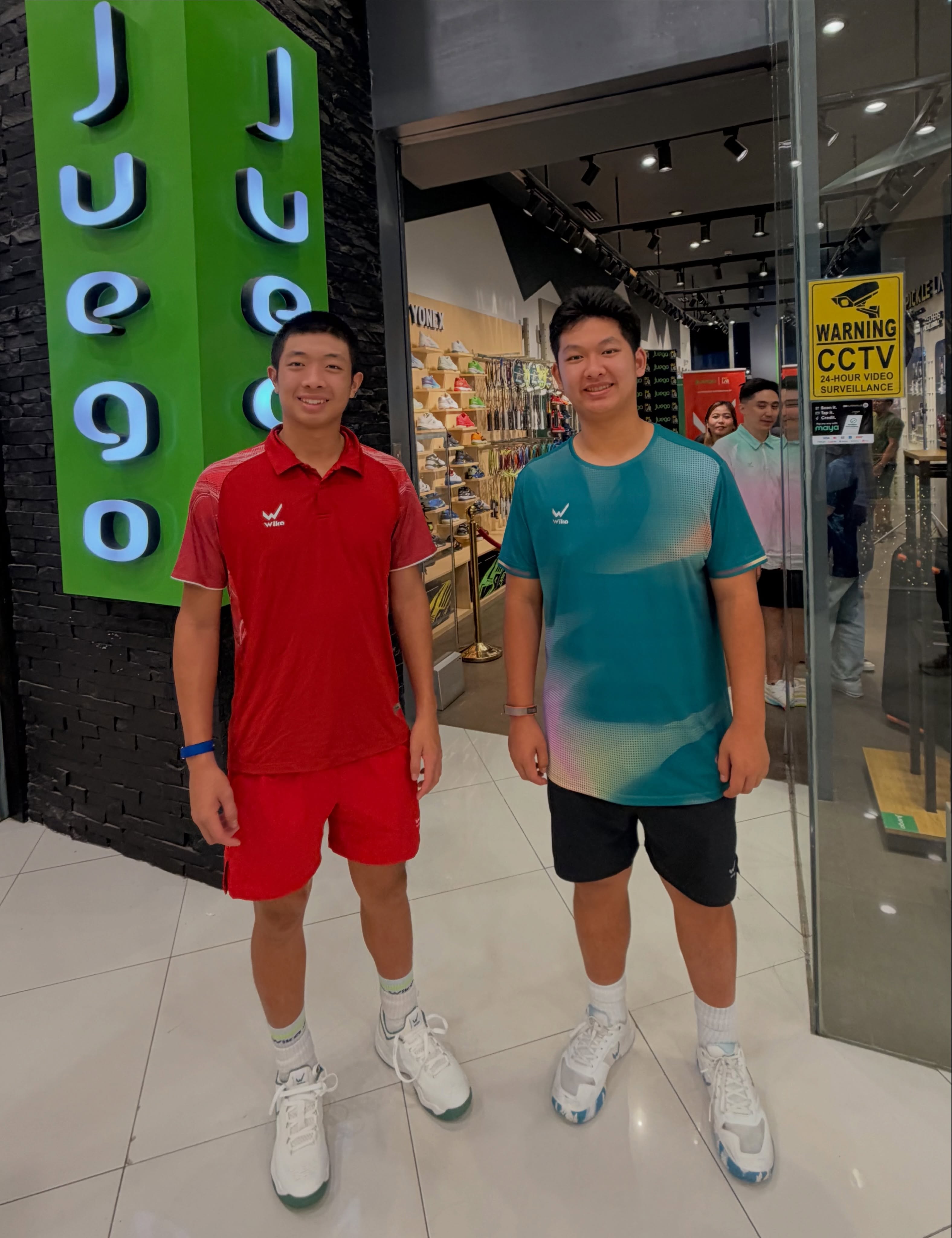 Two Wika-kitted players outside a Juego store in Cebu