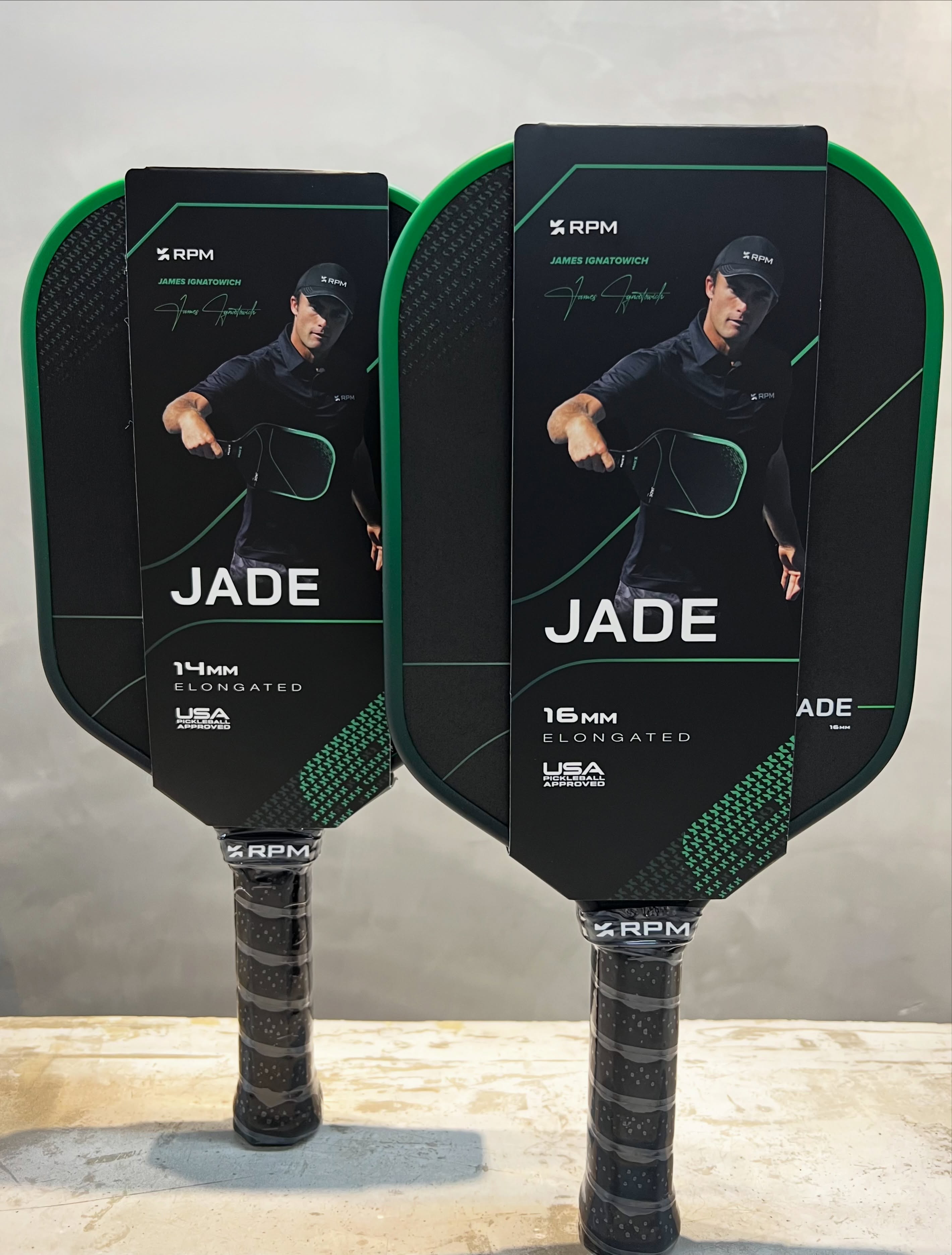 Two RPM Jade Elongated paddles in retail packaging, 14mm and 16mm, with James Ignatowich's name and signature on the packaging