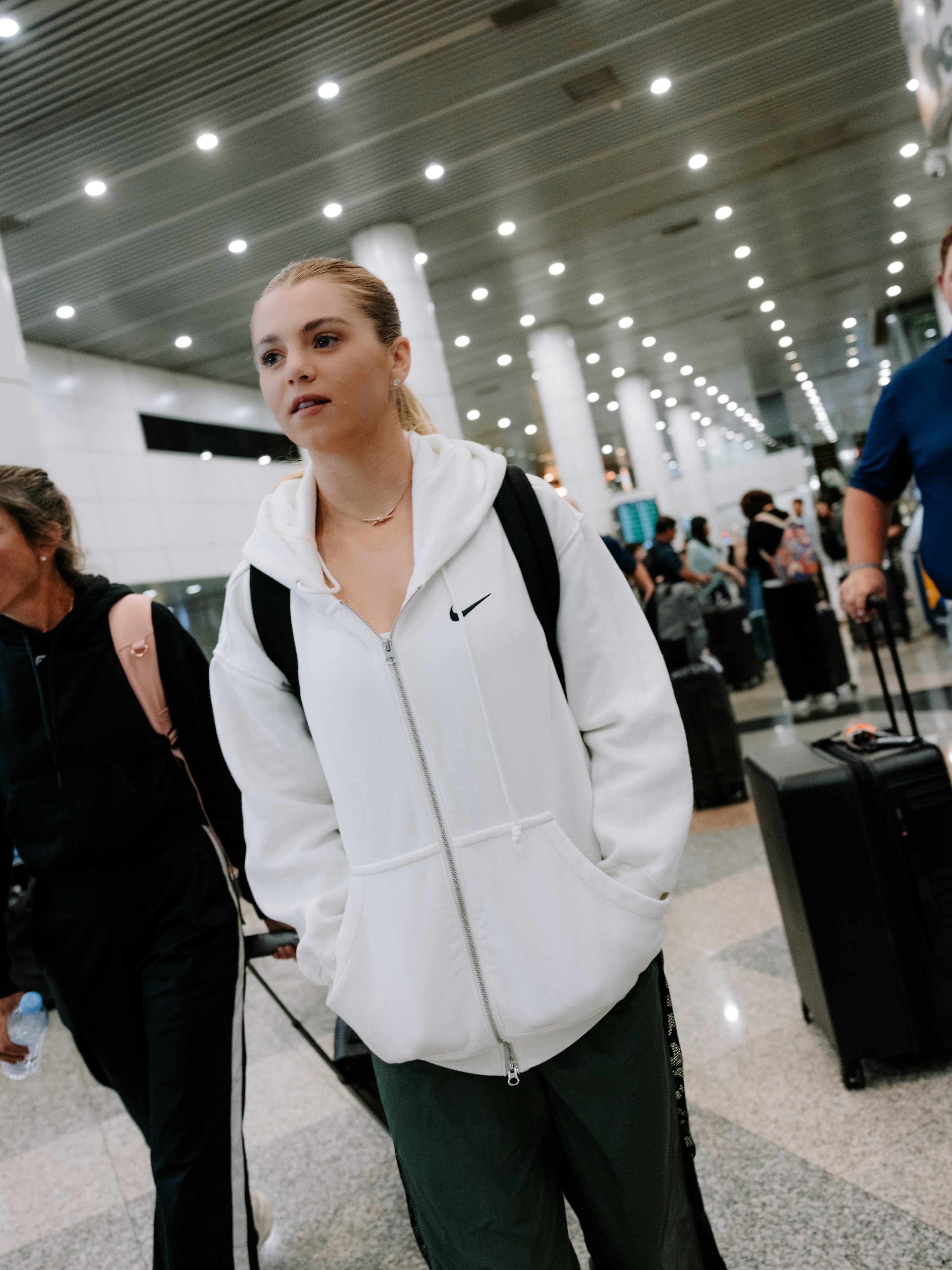 Anna Leigh Waters walking through the arrivals hall
