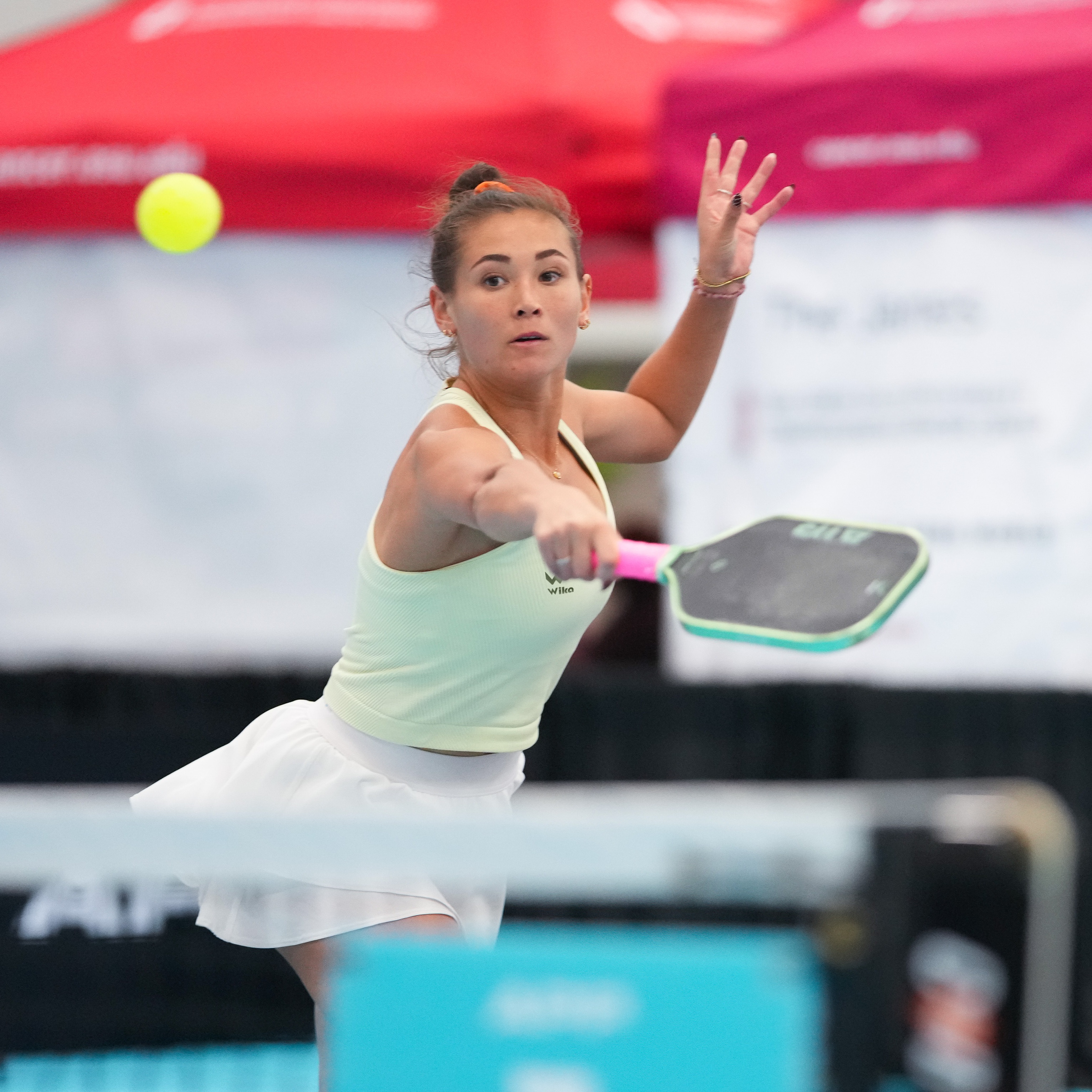 Roos Van Reek hitting a forehand in Wika apparel