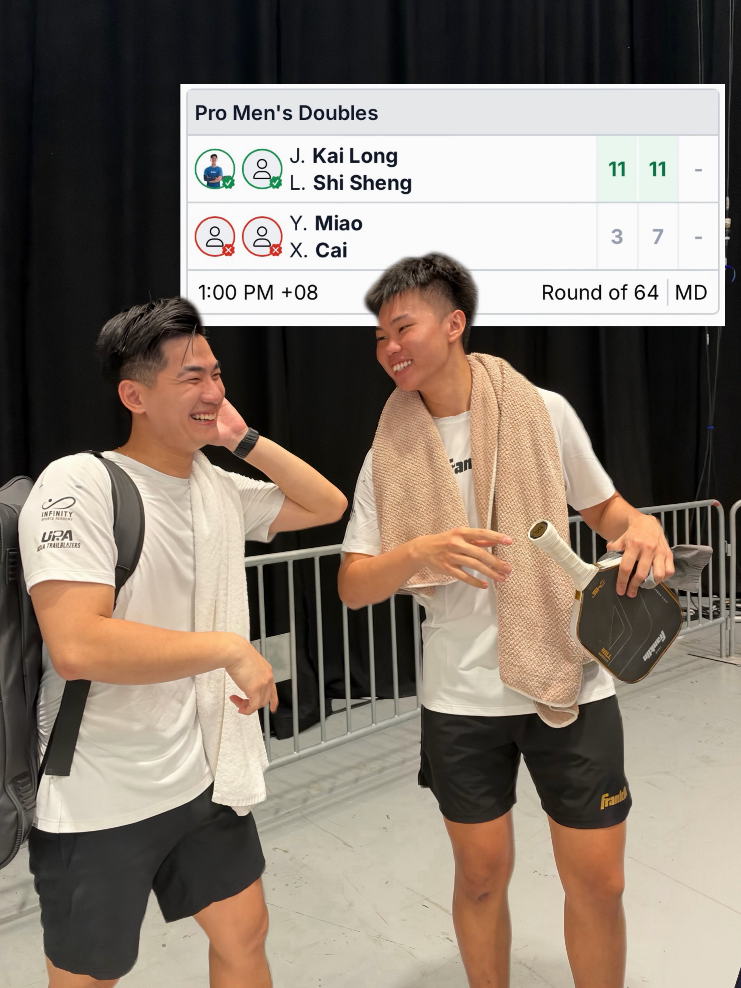 Jimmy Liong and Loh Shi Sheng laughing backstage under a Pro Men's Doubles Round of 64 scoreboard showing 11-3, 11-7