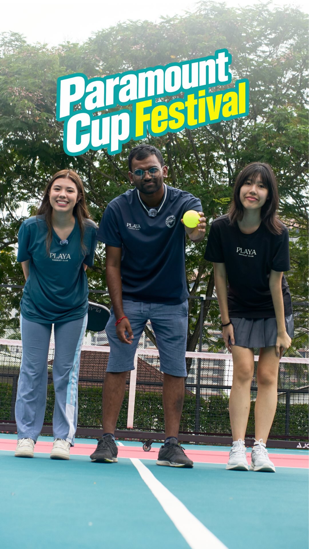 Three people in PLAYA Racquet Club shirts on court with the Paramount Cup Festival title