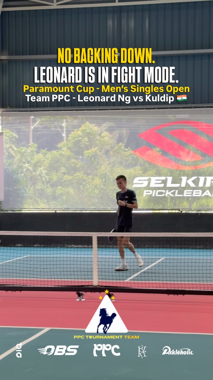 Leonard Ng walking back between points in a Men's Singles Open quarterfinal at the Paramount Cup, with a Selkirk banner behind him