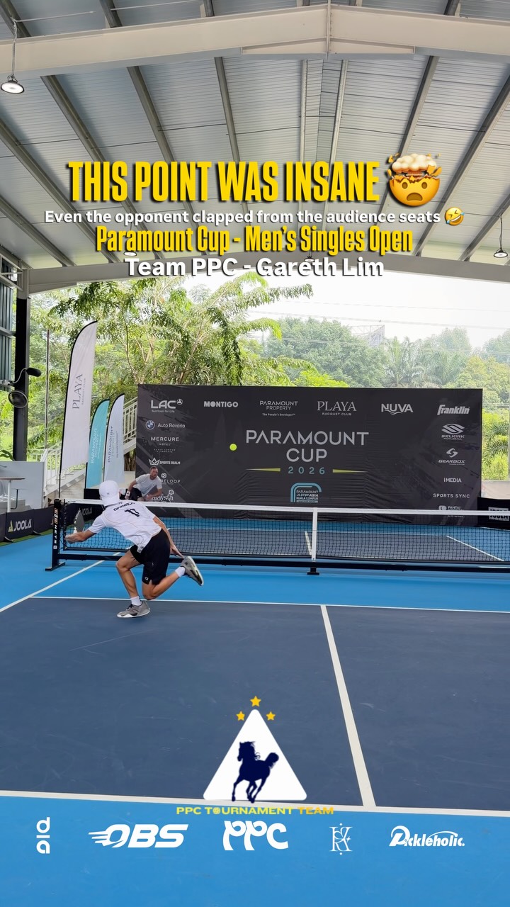 Gareth Lim stretching for a backhand during a Men's Singles Open quarterfinal at the Paramount Cup 2026, with a Team PPC graphic