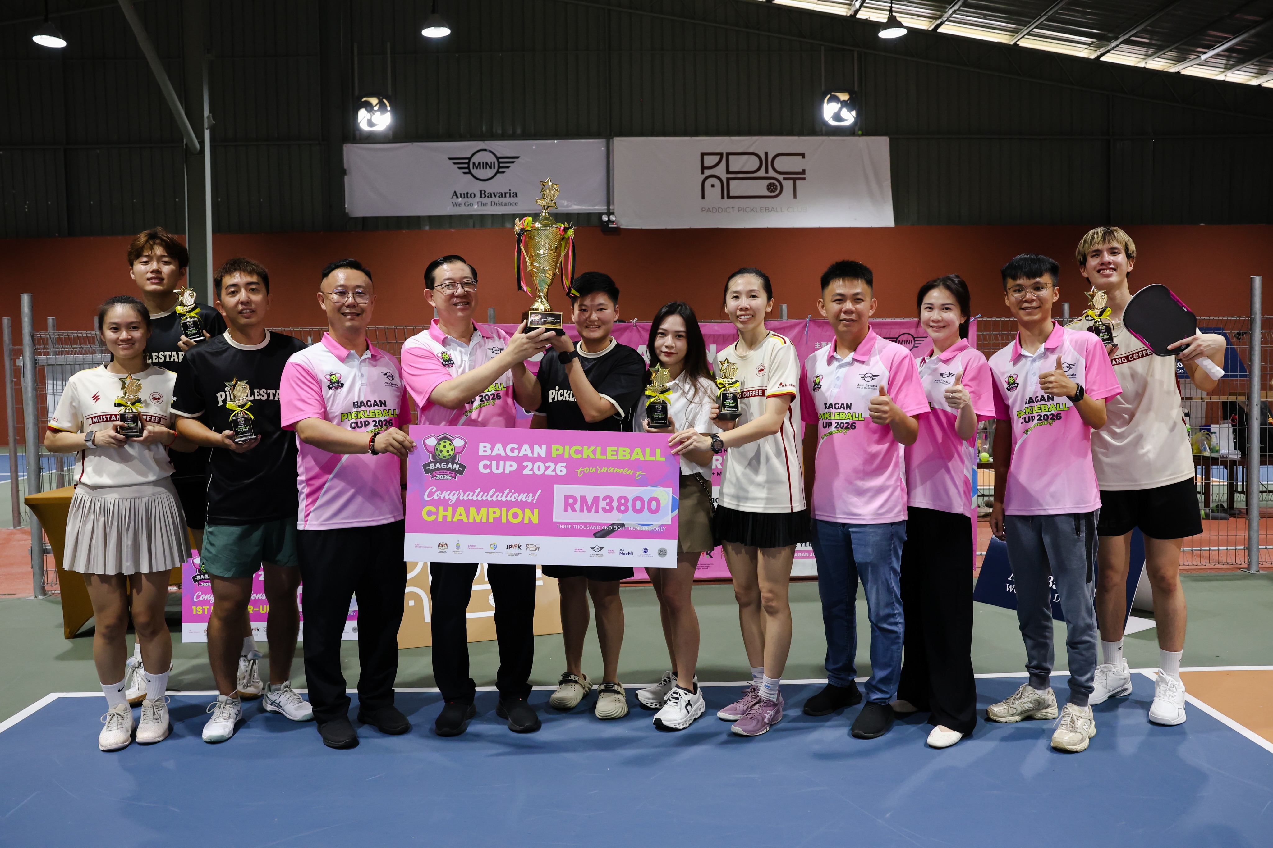 PickleStar and Mustang players with trophies and a RM3800 champion cheque at the Bagan Pickleball Cup 2026