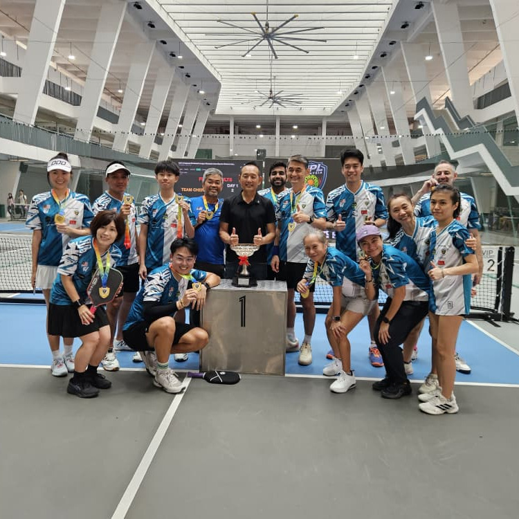 Team Kuala Lumpur players pose with a trophy after the second NPL pre-season fixture